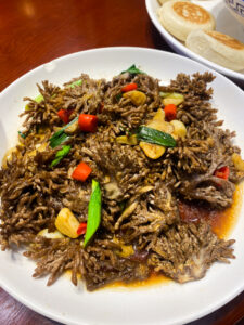 The report captures a plate of Chinese food on a table, showcasing the culinary delights from China.